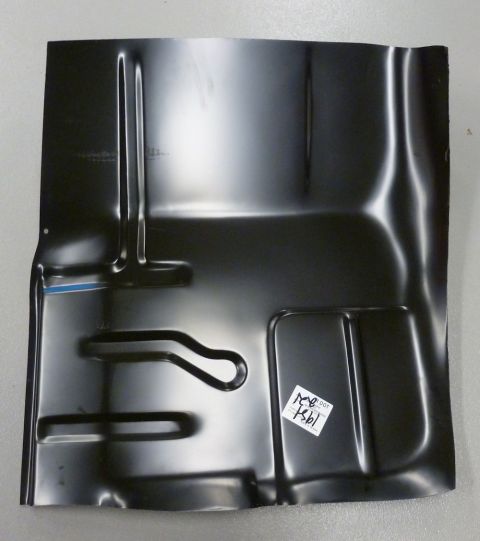 1990 Ford Bronco - A black metal floor pan with stamped contours and a sticker indicating "1991 DOT 7861" is shown.
