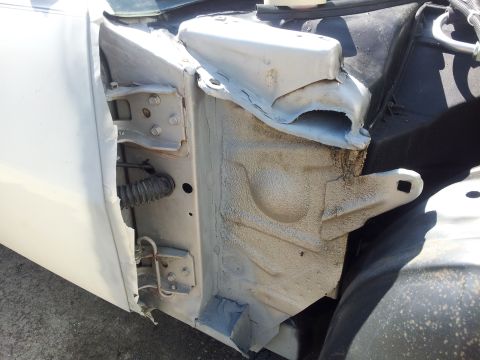 1976 Ford Ranchero - Detail shot of the door hinge mounting area on a vehicle.