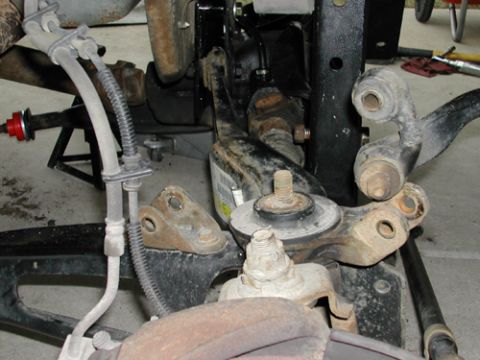 1996 Ford Bronco - Detail view of vehicle suspension components, likely during a lift installation, with a Supermotors.net watermark.