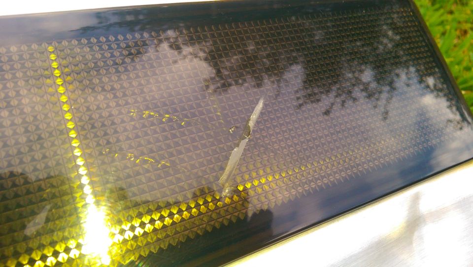 Rear tailgate applique with diamond pattern and yellow lights