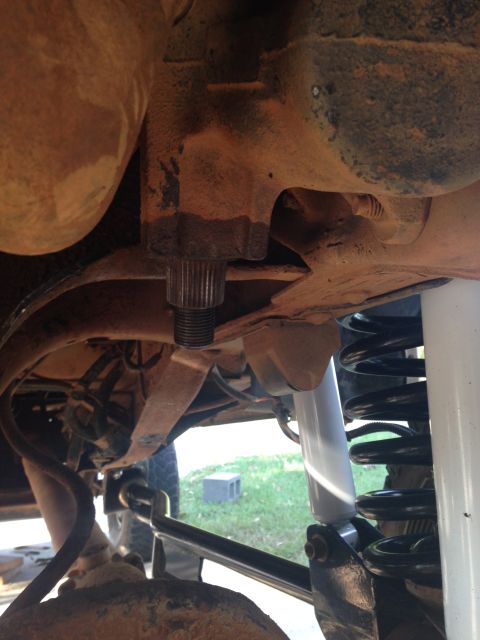 1996 Ford Bronco - Close-up of the vehicle's suspension system, highlighting the components involved in a lift kit installation.