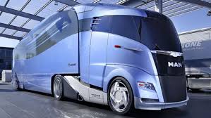 2000 Ford 427 - A futuristic blue truck with a unique design is displayed indoors.