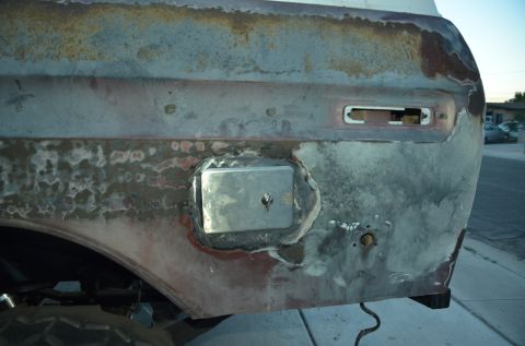 1979 Ford Bronco - This vehicle's rear quarter panel shows significant rust and repair work, with a missing taillight assembly.