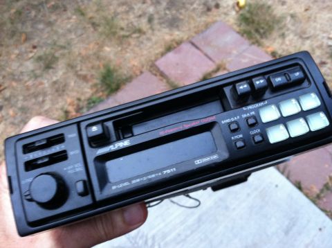 1968 Ford Torino - A black Alpine car stereo with a cassette deck and digital display is shown.