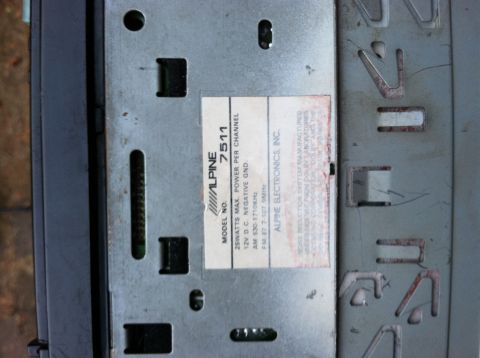 1968 Ford Torino - Close-up of an Alpine 7511 car stereo, showing the model number and technical specifications on a label.