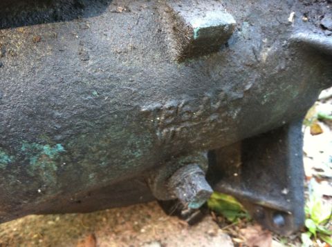 1968 Ford Torino - This close-up shows a heavily greased engine part with stamped casting numbers, suggesting it's a component from a vehicle.