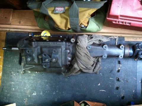 1968 Ford Torino - A transmission part is shown resting on a mat with a tool bag in the background.
