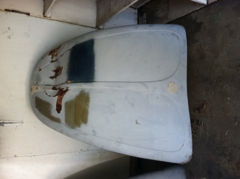 1968 Ford Torino - A primer-coated Volkswagen Beetle hood shows signs of rust and repair work.