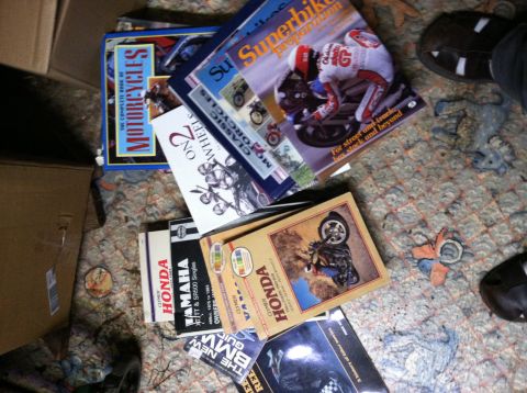 1968 Ford Torino - Various motorcycle repair manuals are scattered on a carpeted floor.
