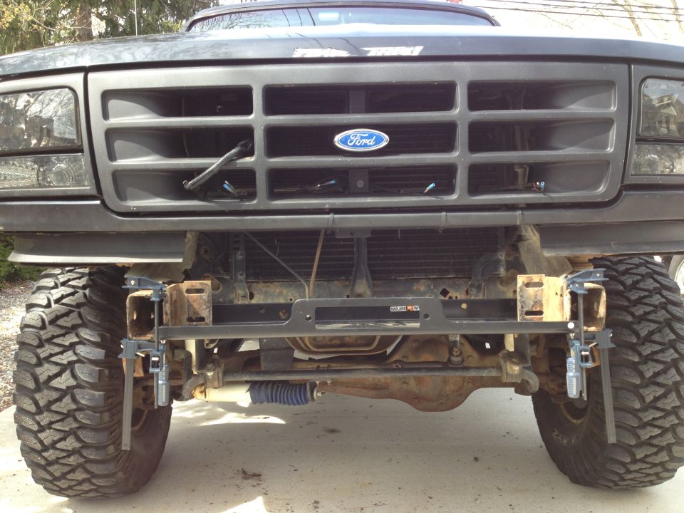 1996 Ford Bronco front grille with Ford logo, custom winch bumper, and large off-road tires
