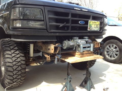 1996 Ford Bronco - This Ford truck, likely from the early to mid-1990s, has a winch installed on a custom bumper mount.