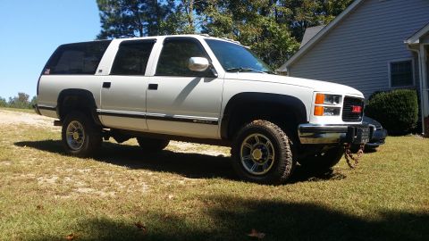 1994 GMC Suburban - BLING! Coming out of retirement! Fresh wash. Nevermind the chain, that is not staying there. That was only there to pull someone out who ha…