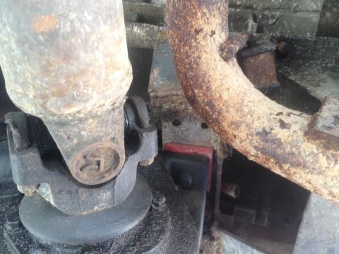 1971 Ford F-250 - Underside view of a vehicle's driveshaft and exhaust system, showing rust and wear.