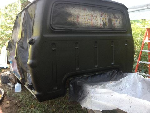 1971 Ford F-250 - Truck bed is being prepped for paint with plastic sheeting and drop cloths.