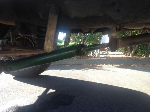 1971 Ford F-250 - Underside view of a vehicle's driveshaft and suspension components, with a tire visible.
