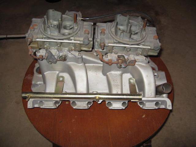 Dual carb intake manifold with two carburetors mounted on top