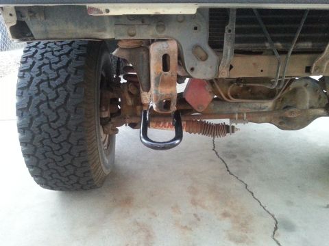 1988 Ford Bronco - Front tow hook and suspension details of an off-road vehicle.