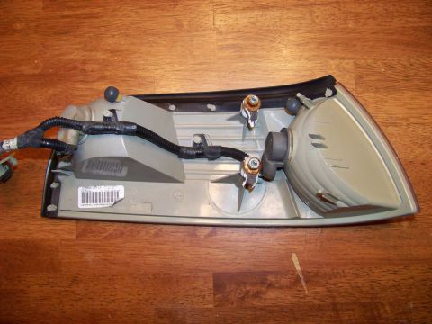 1995 Mercury Grand Marquis - Car tail light assembly with wiring and bulb sockets shown from the rear.