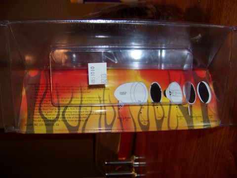 1995 Mercury Grand Marquis - Headlight assembly in its original packaging, showing diagrams of installation and parts.