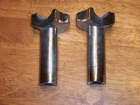 1995 Mercury Grand Marquis - Two chrome-plated metal automotive parts are shown on a wooden surface, with a watermark at the bottom right.