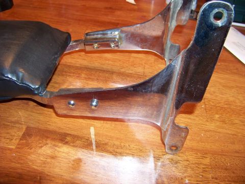 1995 Mercury Grand Marquis - Close-up of a motorcycle passenger backrest part with chrome mounting hardware.
