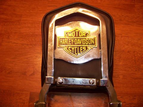 1995 Mercury Grand Marquis - Close-up of a Harley-Davidson Cycles emblem on a motorcycle part.