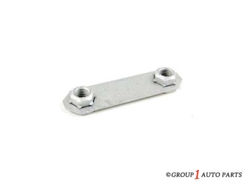 1988 Ford Bronco - A metal bracket with two nuts is shown against a white background.