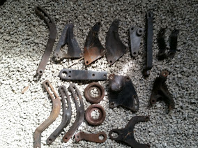 1968 Ford Torino - Various metal automotive parts are displayed on a gravel background, with a visible watermark.