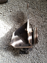 1968 Ford Torino - Engine pulley bracket shown against a gravel background. Text overlay indicates 'SUPER MOTORS'.