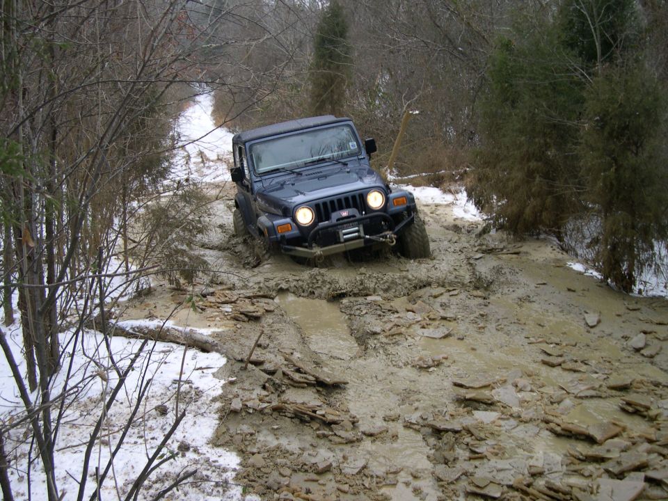 My buddy in his TJ.  He'd rather be climbing rocks, but we managed to get him dirty today.