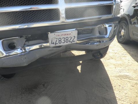 1994 Ford F-250 - This truck's front bumper is heavily damaged, with visible bends and scrapes.