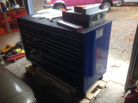 1992 Ford F-150 - A pink 1992 Ford F-150 is visible behind a blue tool chest in a garage.