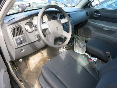 1991 Ford LTD Crown Victoria - The interior of a car is visible, showing the dashboard, steering wheel, and seats.