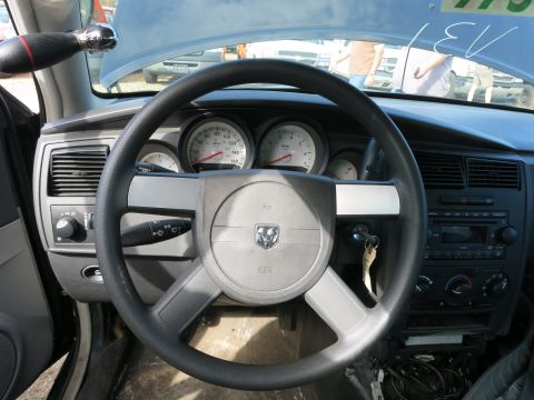 1991 Ford LTD Crown Victoria - The interior of a Dodge vehicle is shown, focusing on the steering wheel and dashboard.