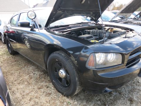 1991 Ford LTD Crown Victoria - Police car with hood open, parked outdoors. Another vehicle is partially visible in the background.