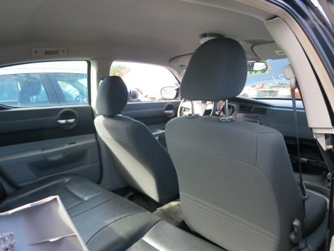 1991 Ford LTD Crown Victoria - The interior of a sedan is shown, with a view of the front and rear seats, and the dashboard.