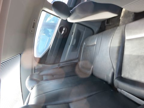 1991 Ford LTD Crown Victoria - Interior view of a car's back seats and door panel.