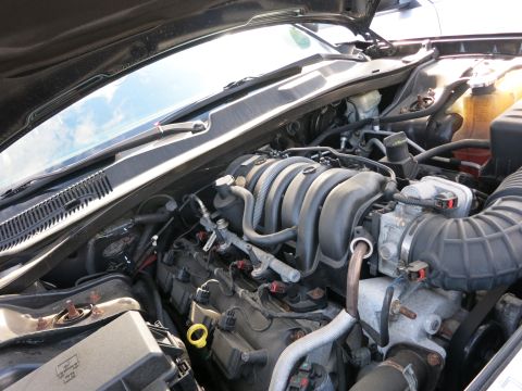 1991 Ford LTD Crown Victoria - Close-up view of a V8 engine bay, showing various components and wiring.