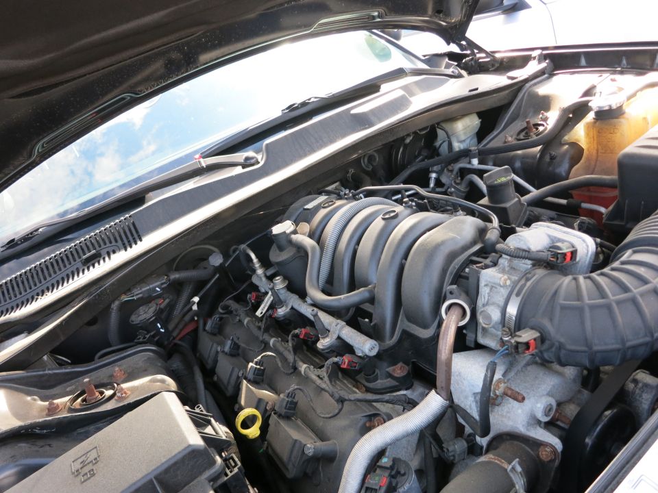 Engine bay with V8 engine components visible