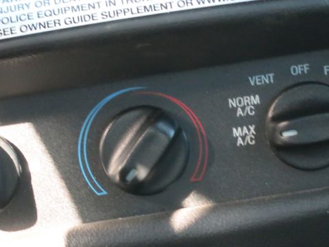 1991 Ford LTD Crown Victoria - Close-up of the climate control panel, showing temperature and A/C settings.