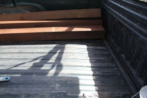 1994 Ford F-250 - Lumber is loaded in the bed of a truck.