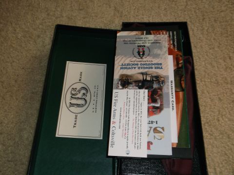 2011 Harley-Davidson Elec Gld Police - Documents and a card are laid out inside an open dark green box on a carpeted surface.