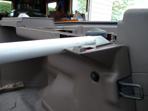 1993 Mazda MX-3 - Close-up of the interior trim and latch hardware, showing plastic components and a metal loop.