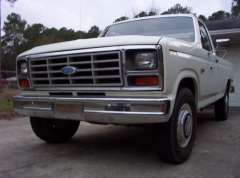 1985 Ford F-250 - Frontal view of a white Ford F-Series truck, likely from the early 1980s.