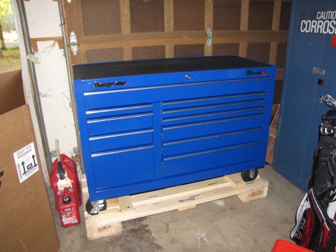 1992 Ford F-150 - A blue Snap-on toolbox sits on a pallet in a garage, with a red gas can to its left.