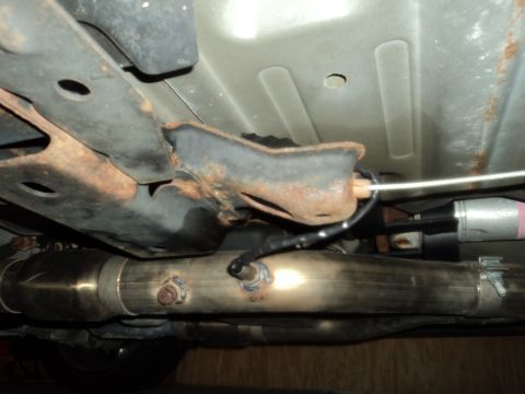 2004 Mercury Grand Marquis - Undercarriage view shows a custom exhaust system, possibly part of a Marauder Eaton Swap, with a Supermotors.net watermark visible.