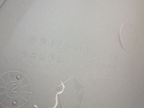 1987 Dodge 1500 - Close-up of a vehicle part showing embossed numbers and the Chrysler pentastar logo.