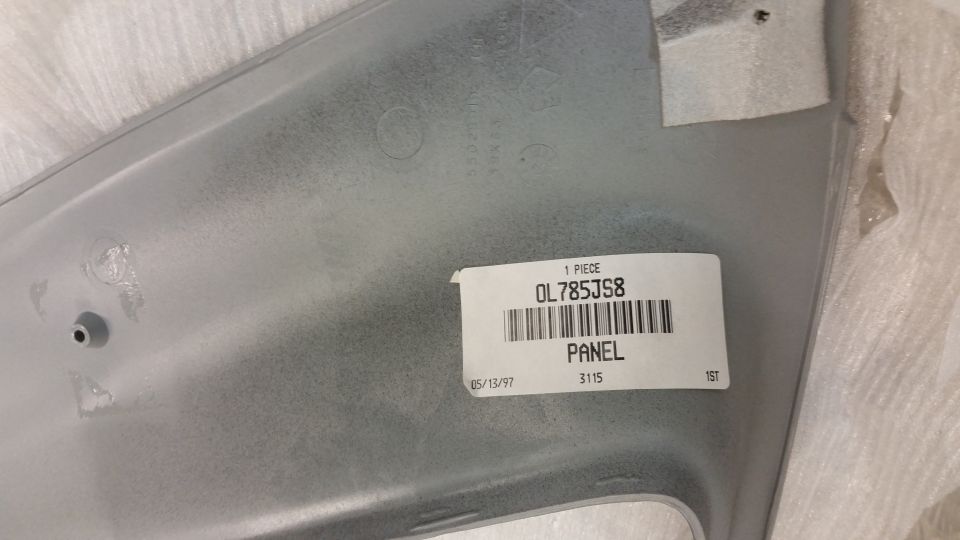 Silver panel with part number OL785JS8 and date 05/15/97