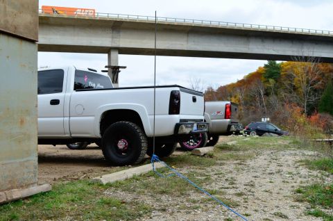 2006 Chevrolet Silverado 2500 - White 2006 Chevrolet Silverado 2500 and other vehicles parked near a bridge.