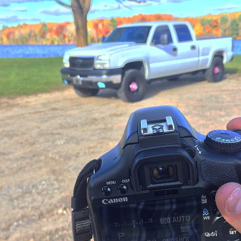 2006 Chevrolet Silverado 2500 - A white 2006 Chevrolet Silverado 2500 pickup truck is seen from the perspective of a camera.